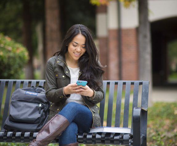 student using mobile phone